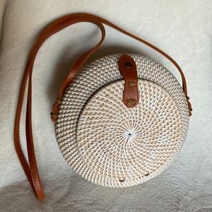 Hand made straw and bamboo purse with beautiful round edges.